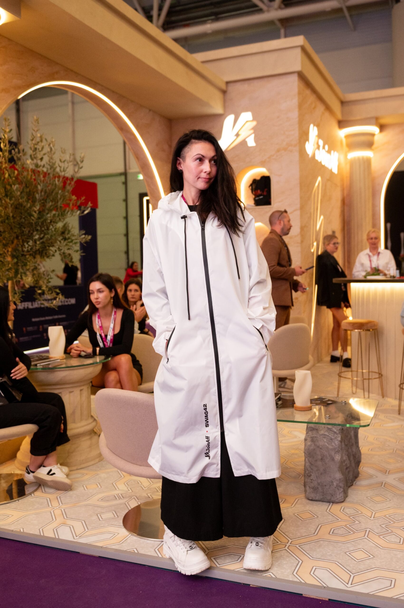 Waterproof white raincoat with a zip closure