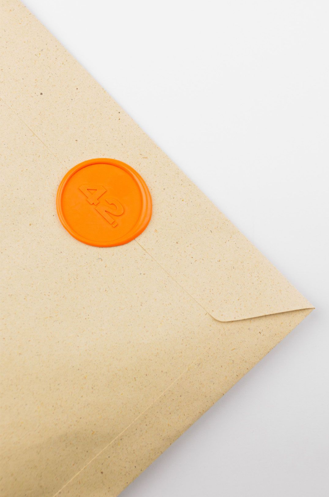 Grass paper envelope with a wax seal cor corporate gifts