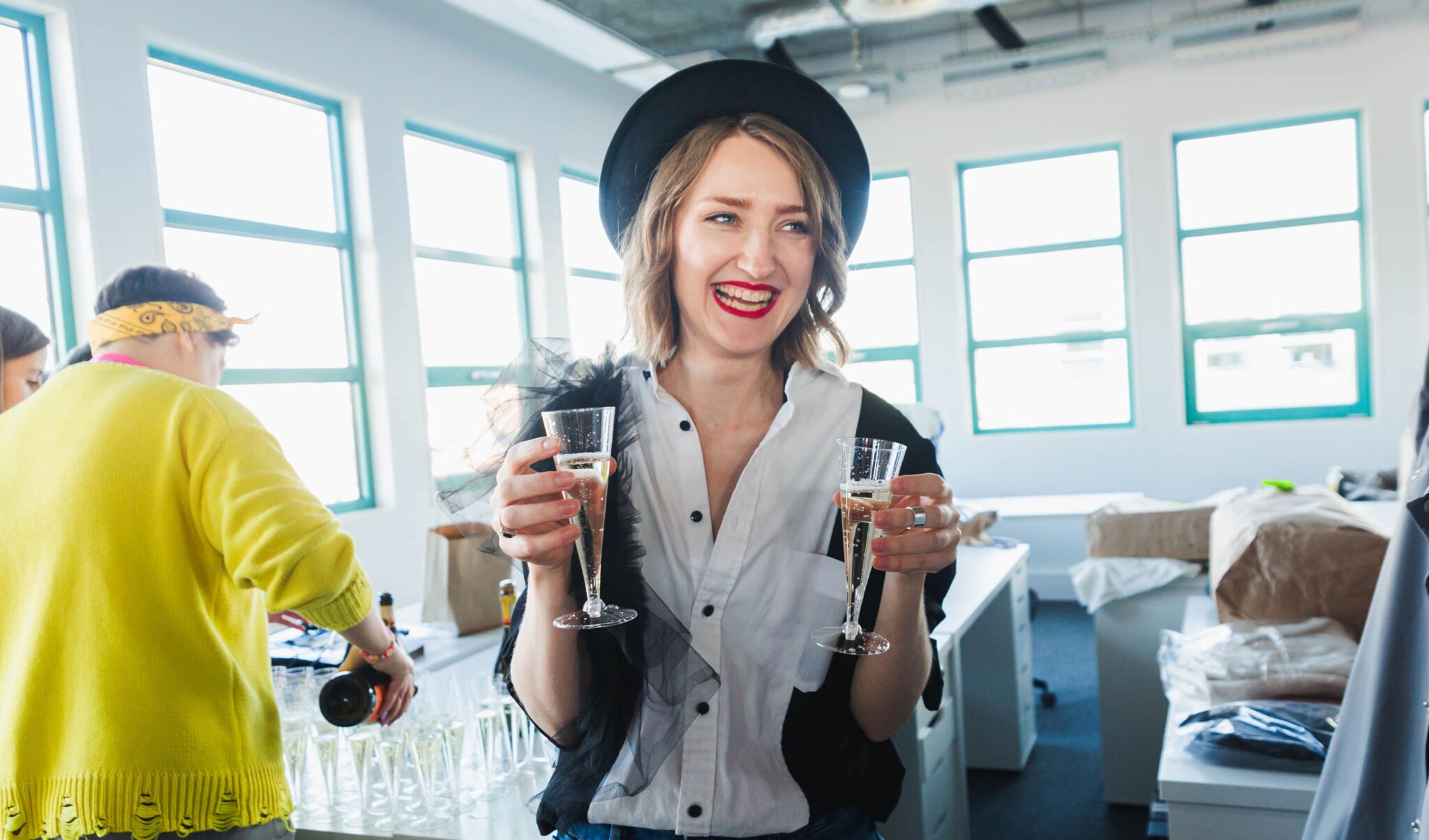 Girl carrying prosecco at Swag42 X HRen meetup
