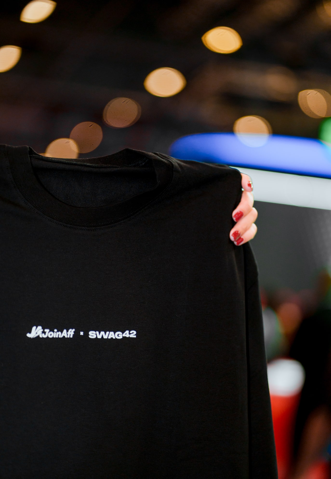 Customized grey T-shirt with logo for custom event merchandise. 